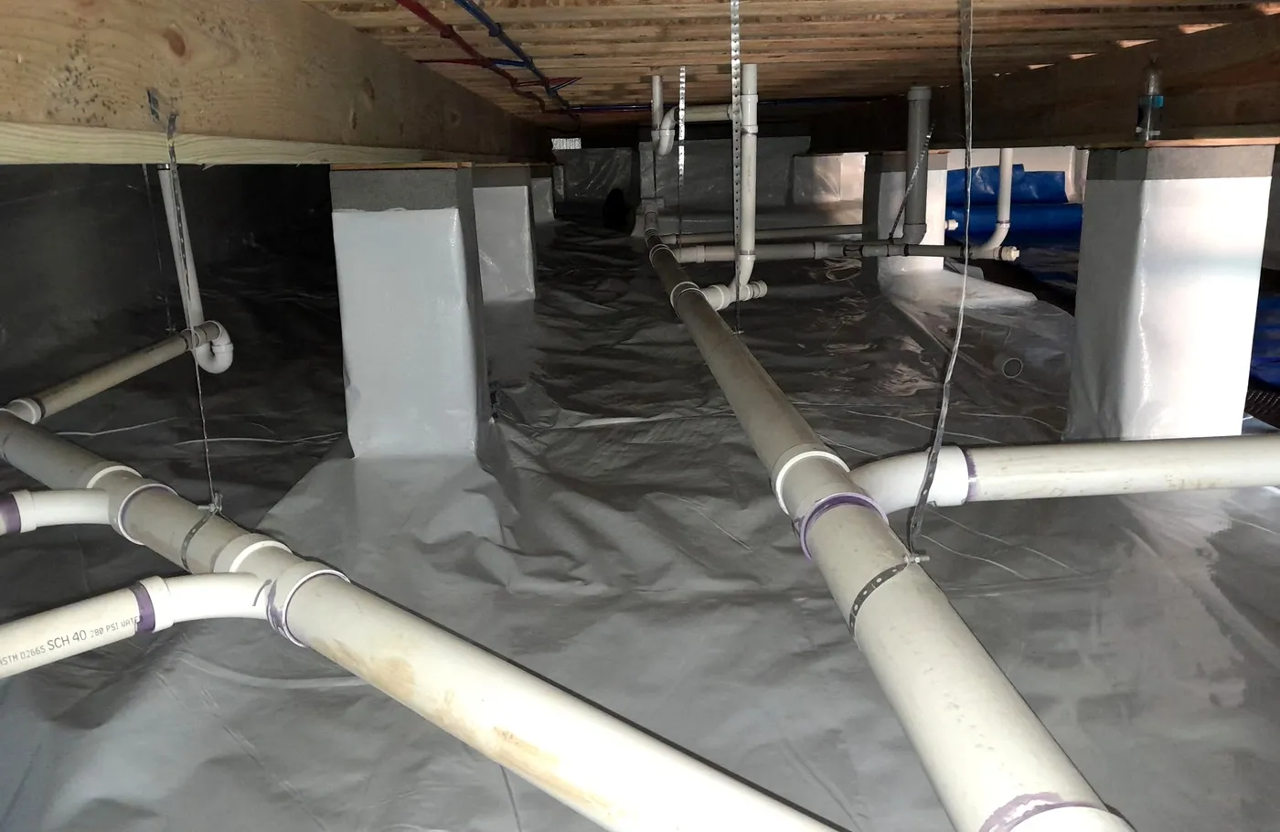After: the same crawlspace in Little Rock, AR, sealed and dry.